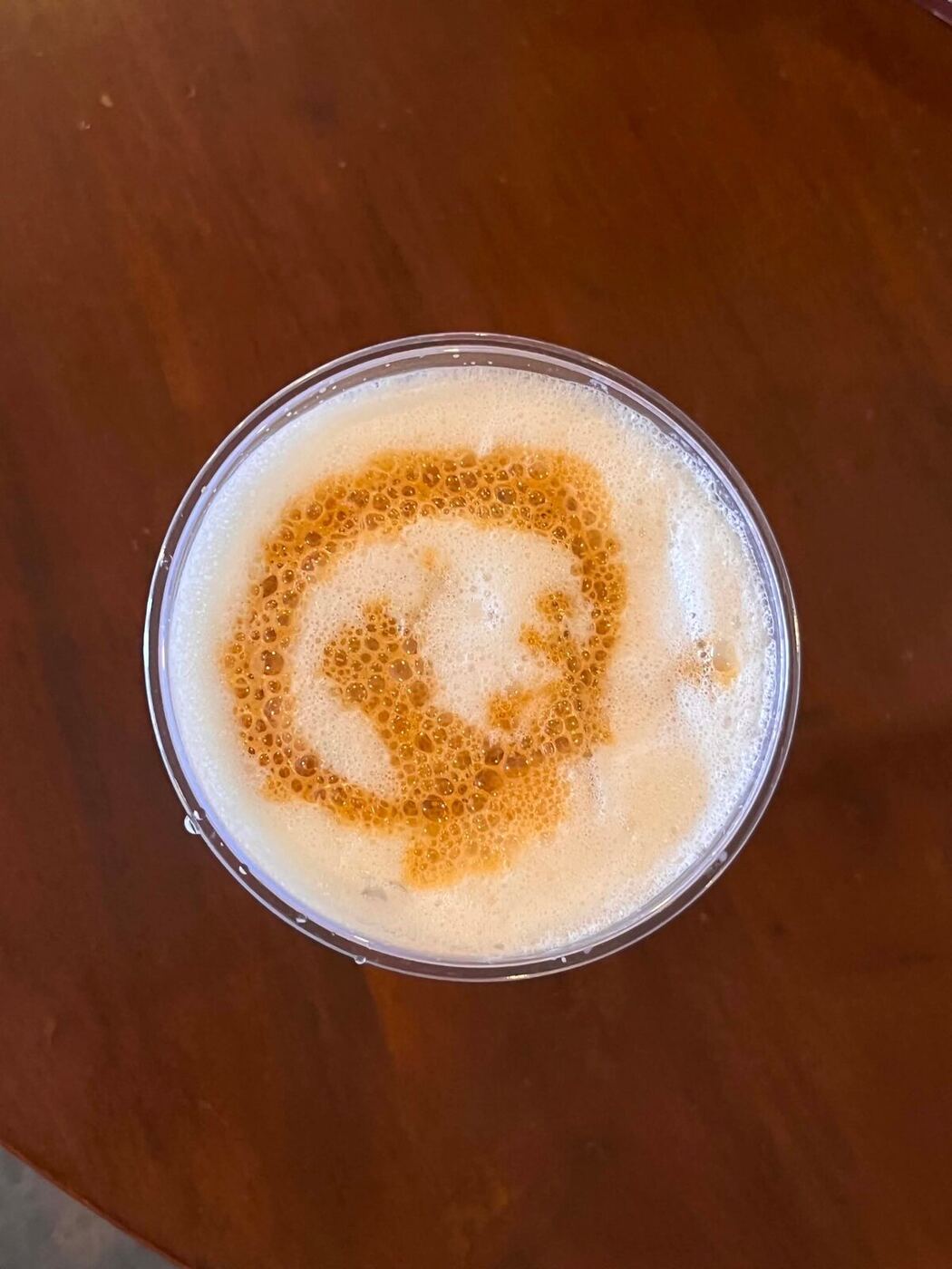 Overhead view of latte art swirled into foam