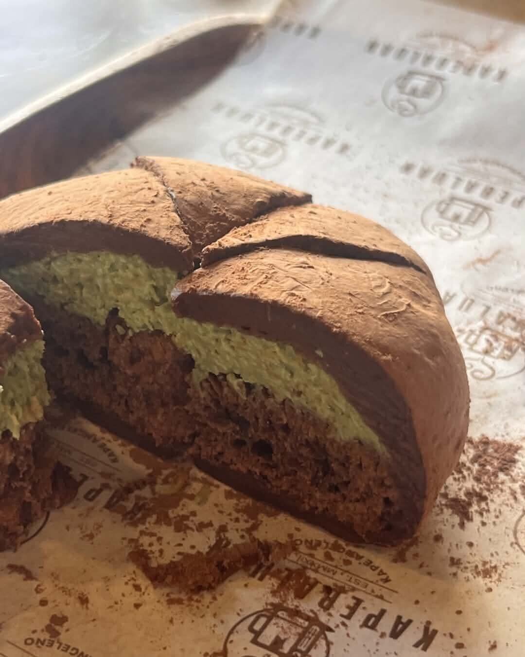 A sliced matcha chocolate cake roll