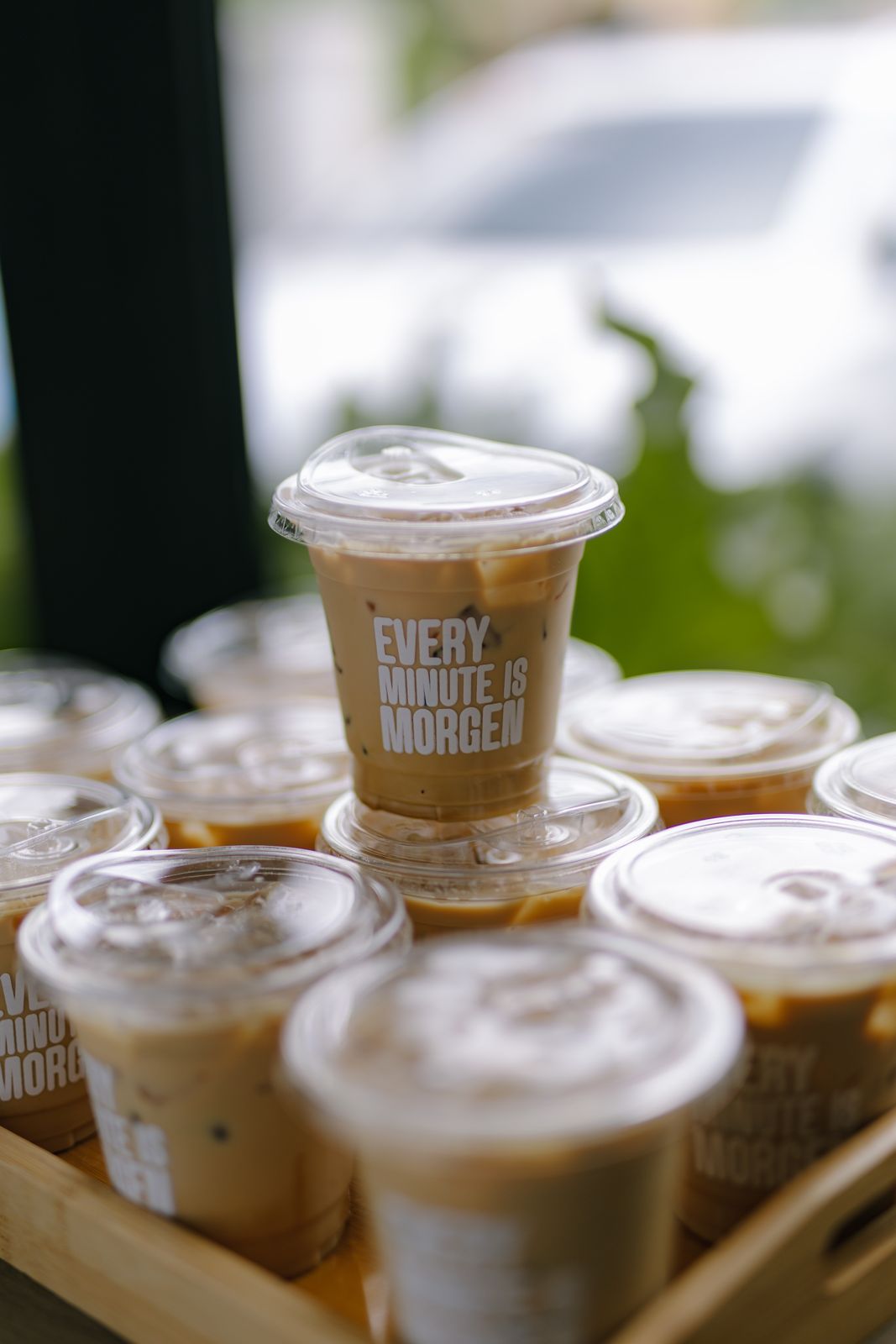 Trays of iced lattes served at an event